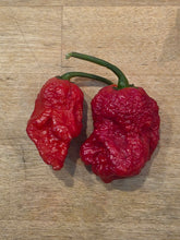 Load image into Gallery viewer, Red Deadpool pepper pods with gnarly blistered texture, extreme super hot isolated seeds by Atomic Pepper Seeds
